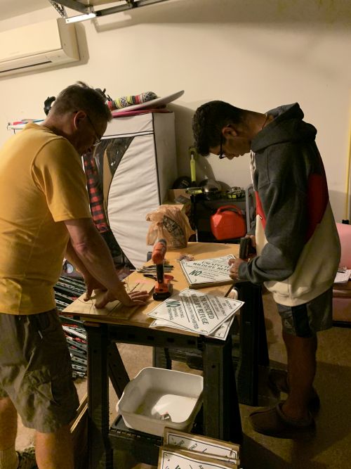 Ryan Cherfane preparing signs